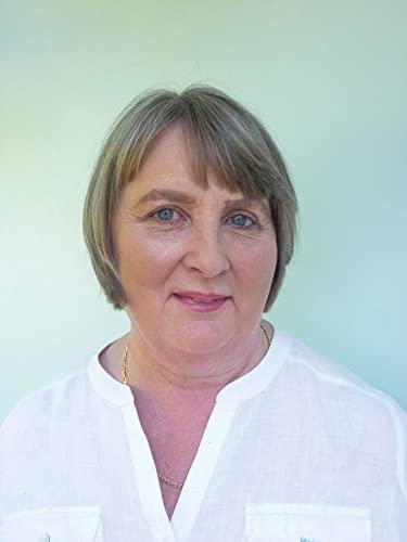 A portrait of a middle-aged woman with short brown hair wearing a white shirt.