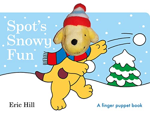Yellow puppy Spot with a red hat throws a snowball in the snow.