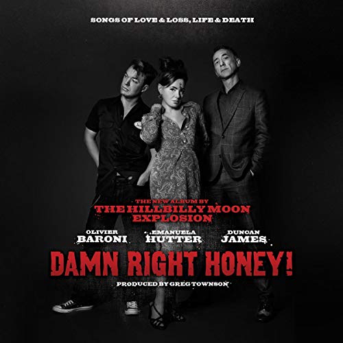 Black and white album cover featuring three band members posing against a dark background.