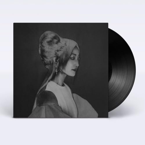 Vinyl record with grayscale portrait of a woman looking downward.