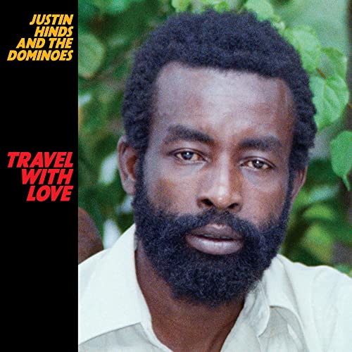 Album cover featuring a portrait of Justin Hinds with text “Travel With Love”.