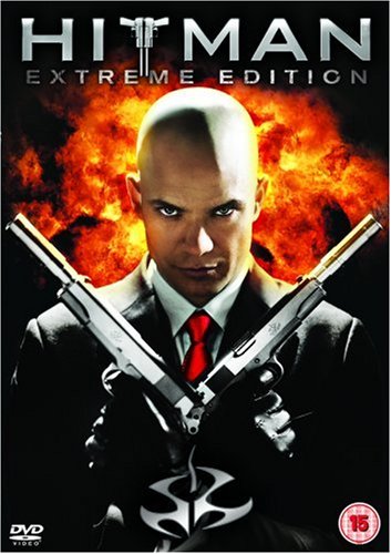 Bald man in suit holding two guns, "Hitman - Extreme Edition" DVD cover.