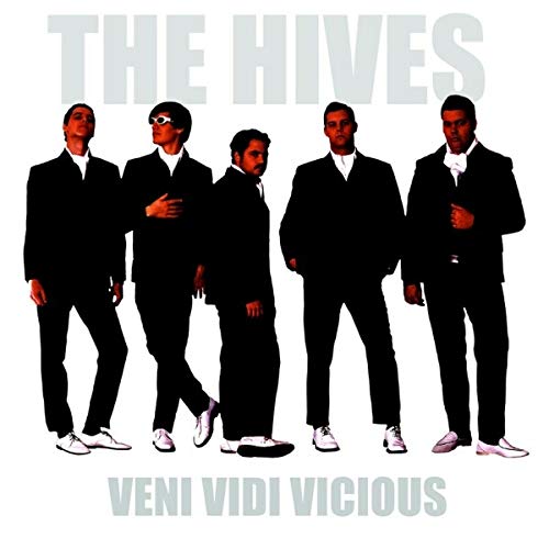 The Hives band members in black suits, album cover for "Veni Vidi Vicious".