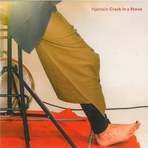 Album cover: a person's leg on a red carpet, with text "Hjaltalin Crack In a Stone".