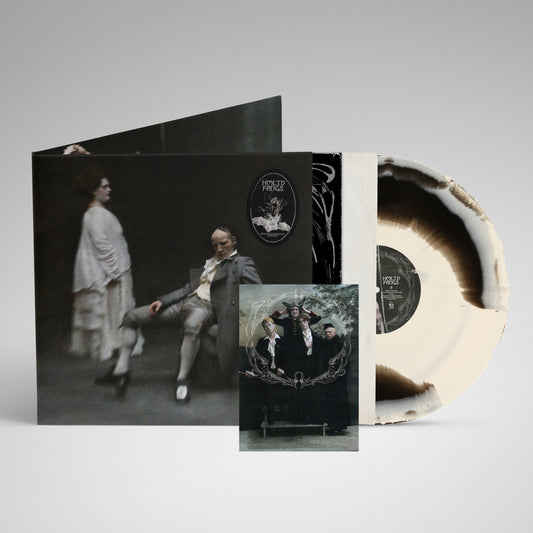 HMLTD "Fangs" vinyl record with splatter effect and gothic-style cover art.