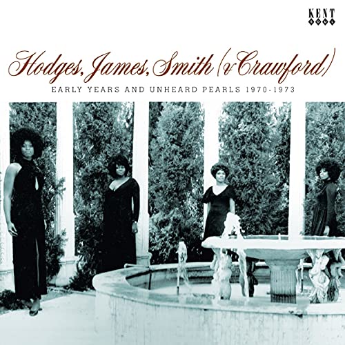 "Album cover featuring a black and white image of four women by a fountain."