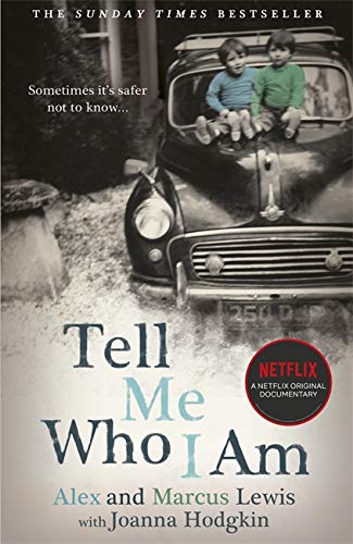 Book cover with vintage car and two young boys, “Tell Me Who I Am” title.