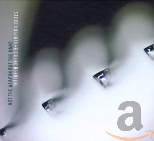 CD cover: abstract grayscale image of crystals and text, Amazon logo.
