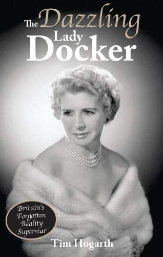 Black and white portrait of a woman with a fur stole and pearls.