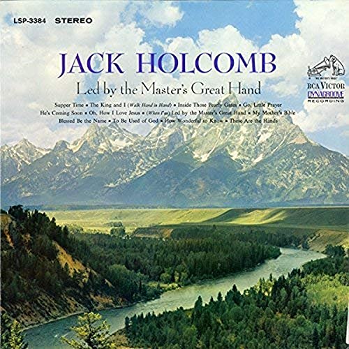 Album cover featuring a river flowing through a valley toward snow-capped mountain peaks.