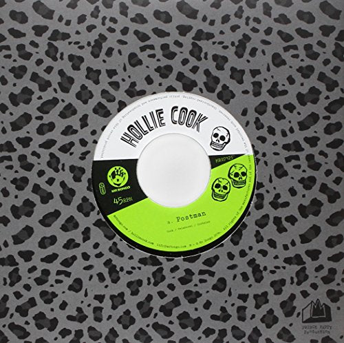 A vinyl record with a black, white, and green label featuring skulls and "Hollie Cook".