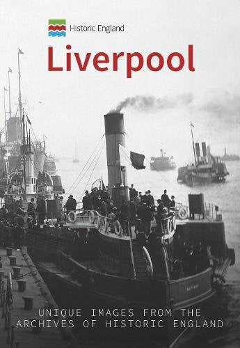 Black and white photo of ships and people at Liverpool docks.