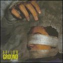 Vinyl record cover: bound and gagged face against a textured background.