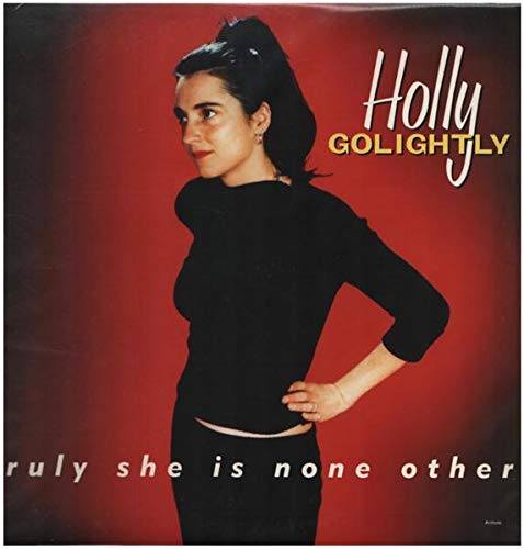 Holly Golightly album cover: woman in black against a red background.