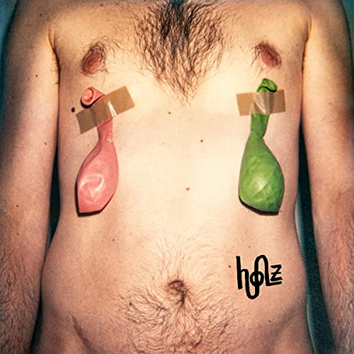 Album cover: torso with taped, colorful balloon shapes over chest.