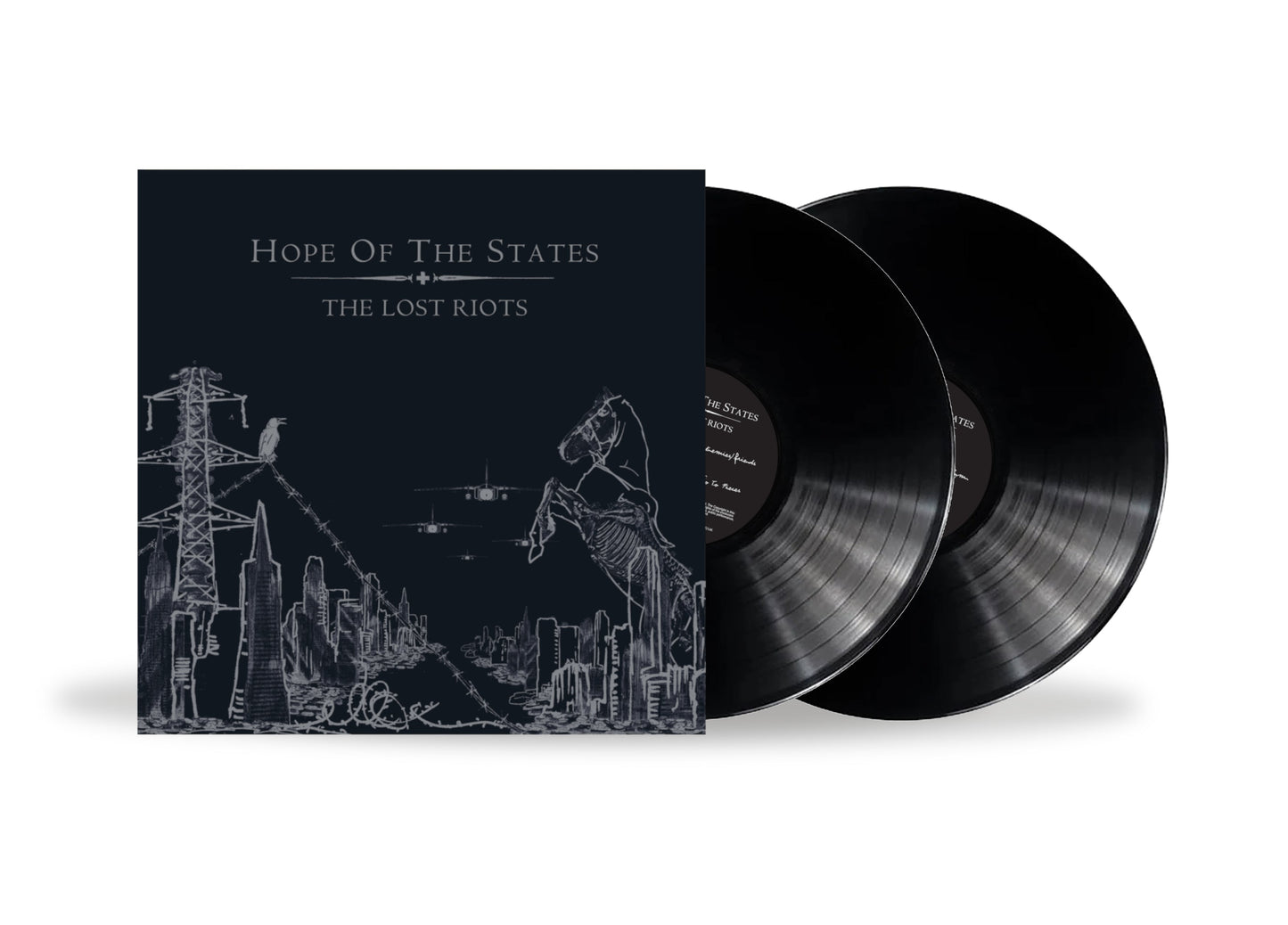 Two black vinyl records with illustrated album cover depicting a city.
