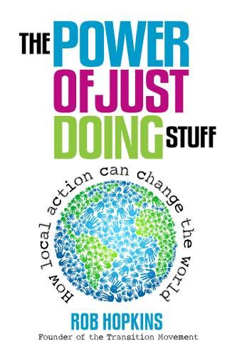 Book cover with colorful title and globe made of blue hands.