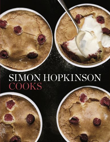 Cookbook cover featuring four baked desserts with raspberries and cream.