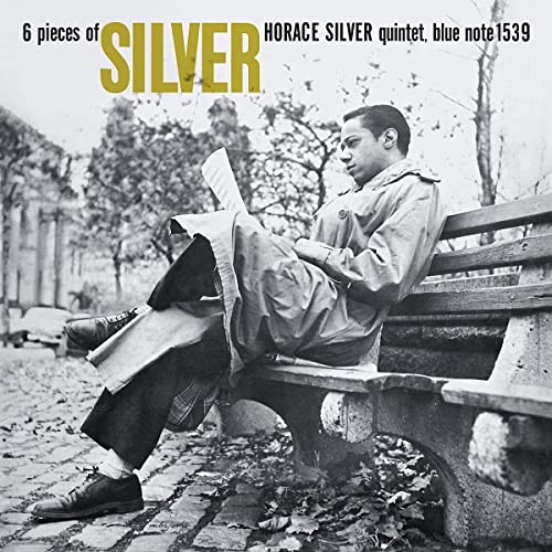 Black and white album cover showing Horace Silver reading on a park bench.