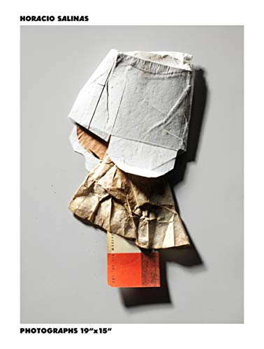 Crushed paper and a small orange card on a gray background.