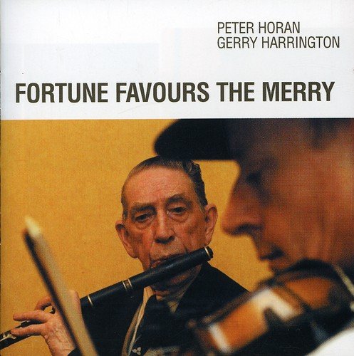 CD cover: two men playing traditional Irish instruments, flute and fiddle.