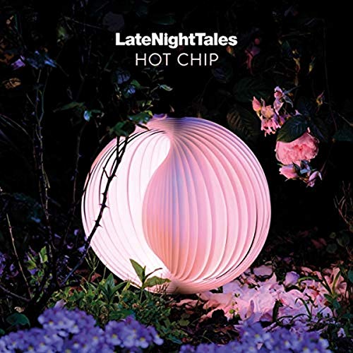 CD cover: glowing orb amidst dark foliage and purple flowers.