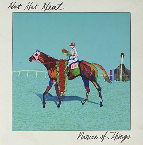 Album cover: jockey on a colorful horse in a racecourse setting.