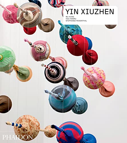 Book cover featuring colorful, spherical textile sculptures suspended by threads.