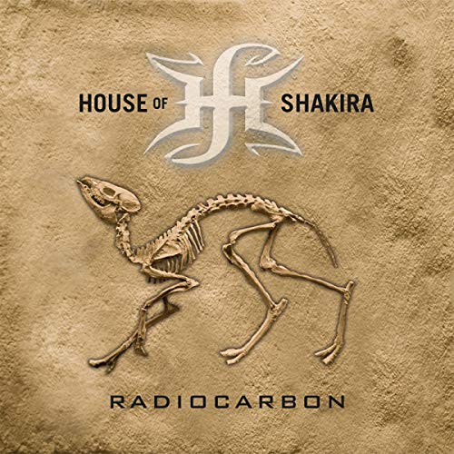 CD cover for Shakira’s “Radiocarbon” featuring a fossilized animal skeleton.