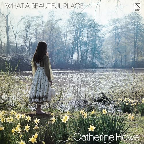 A girl in a patterned dress stands by a pond surrounded by yellow daffodils.