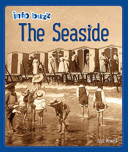 Vintage photo of children playing on a beach with bathing machines.