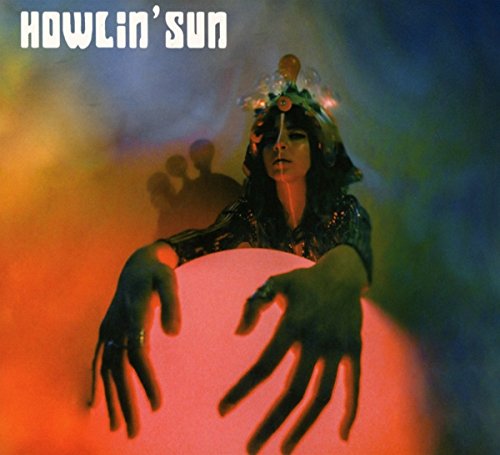 Album cover: woman with glowing orb, psychedelic colors, and band name.