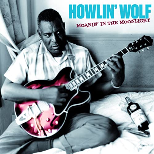 Howlin' Wolf with a red electric guitar, album cover image.