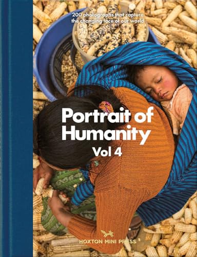A woman in an orange sweater carries a sleeping baby while sorting dried corn.