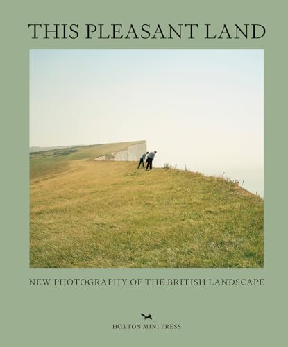 Book cover showing two people walking on a grassy cliff edge near white chalk cliffs.