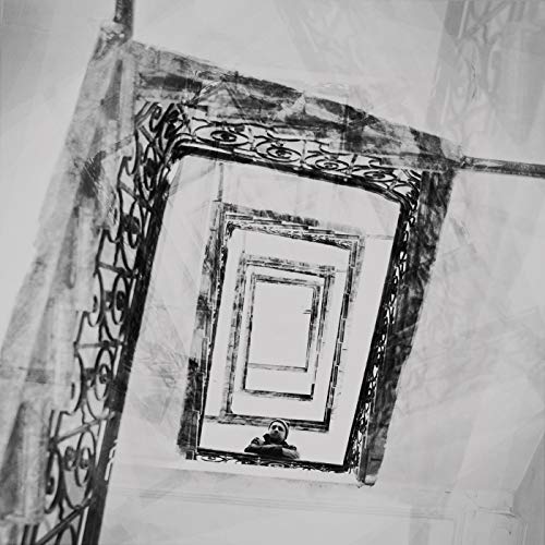Black and white vinyl record cover with a spiral staircase and figure.