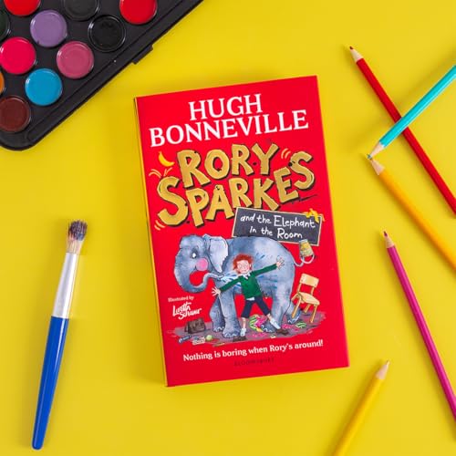 Red children’s book cover with an elephant and a boy, surrounded by art supplies.