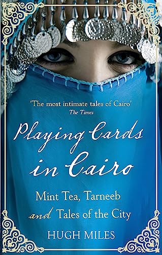 Book cover with a veiled woman’s eyes and ornate silver headdress.