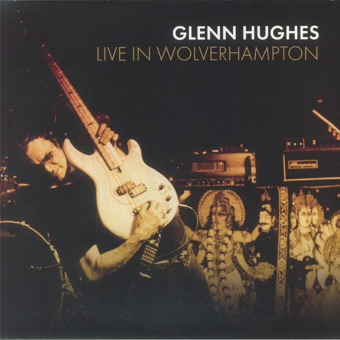 Glenn Hughes playing bass guitar live on stage, album cover.