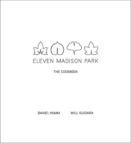 White cookbook cover with minimalist leaf design and title "Eleven Madison Park.