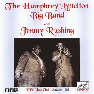 Album cover with two men, one holding a trumpet, in suits against a black background.