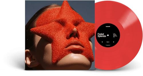 Red vinyl record and album cover featuring a face with a star.