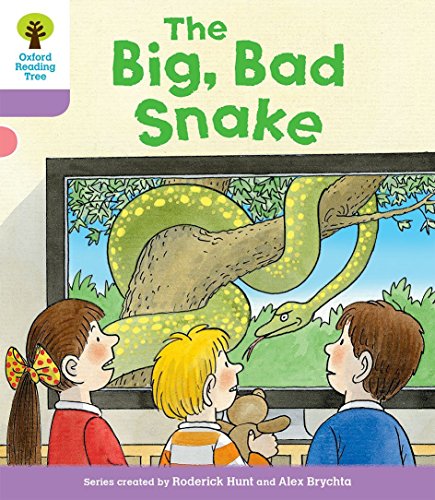 Children looking at a large green snake coiled around a tree branch.