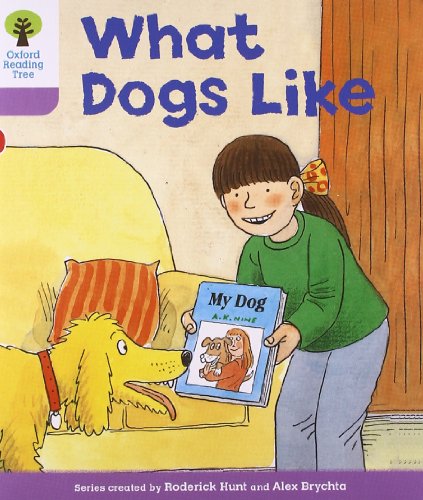 Girl with golden retriever and a book titled “My Dog.”