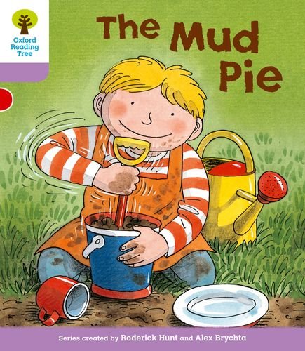 Boy making a mud pie with a bucket and watering can.