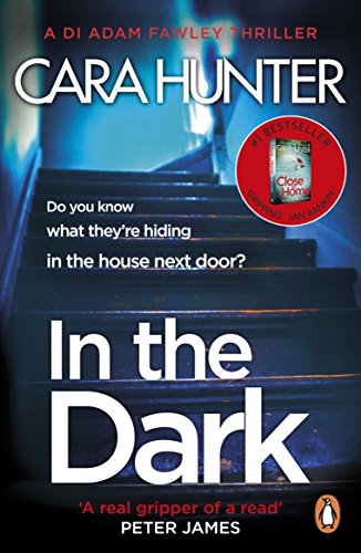 Book cover with dark staircase, title "In the Dark", and author Cara Hunter.