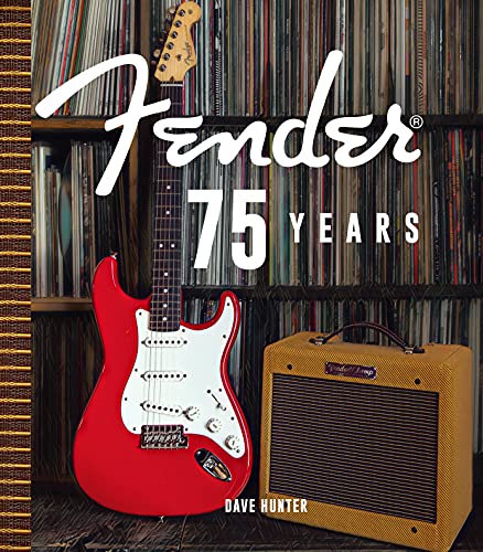 Red Fender Stratocaster guitar and amplifier in front of vinyl records.
