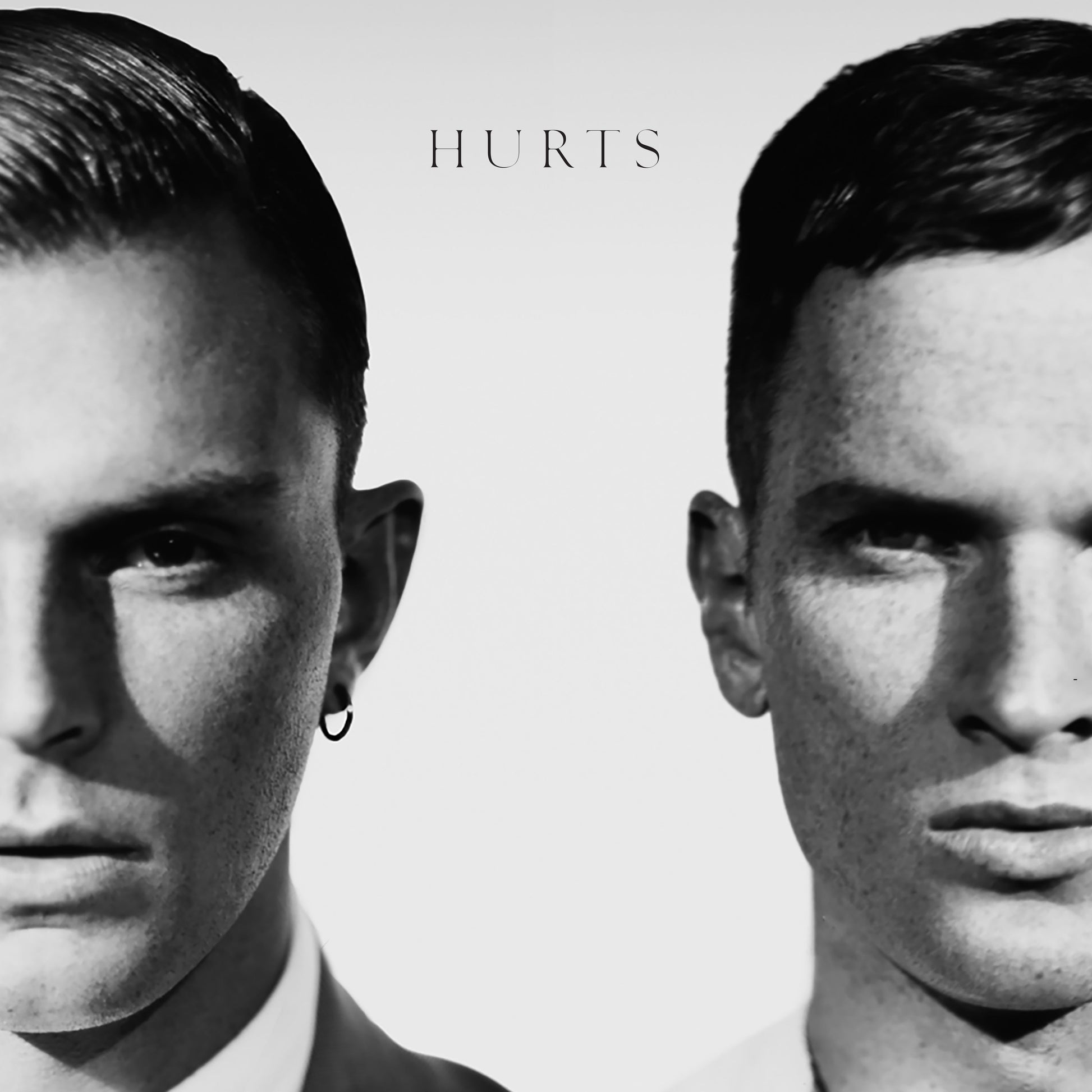 Black and white album cover featuring two men’s faces, side by side.
