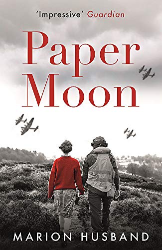Book cover: couple walking hand-in-hand with planes in a grey sky.