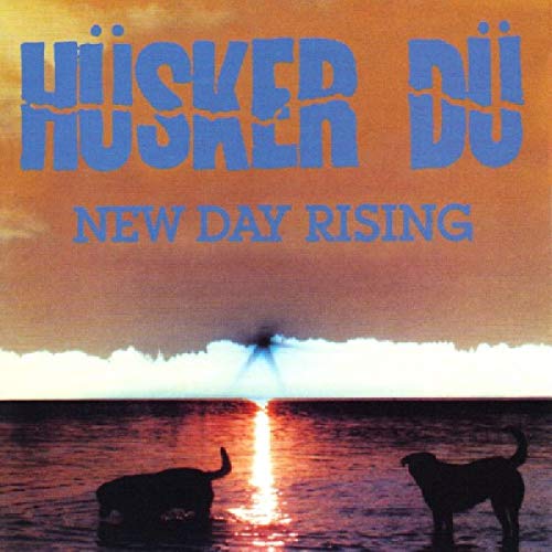 Album cover showing two dogs in water at sunset with blue text above.